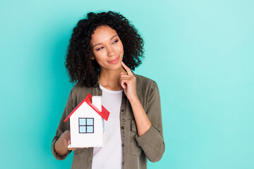 Portrait of attractive trendy curious cheerful girl holding house copy space choose purchase...