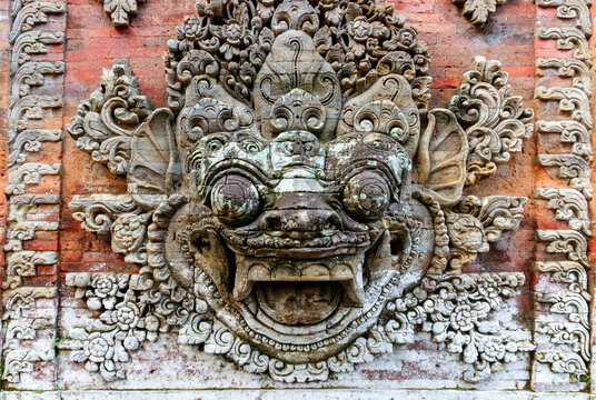 Ubud, Bali, Indonesia. Traditional Indonesian totem of a sacred creature on the wall of the ancient Ubud palace puri saren agung.