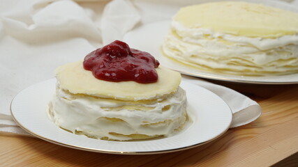 vanilla crepe cake with strawberry topping