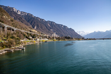 Montreux, Switzerland 04.04.2021 - View from Chillon Castle Chillon Viaduct, Lake Geneva and the Alps in the background