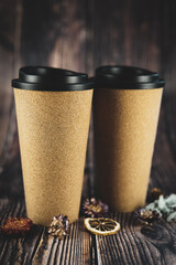a cup for coffee or tea on a beautiful wooden background. thermo mug