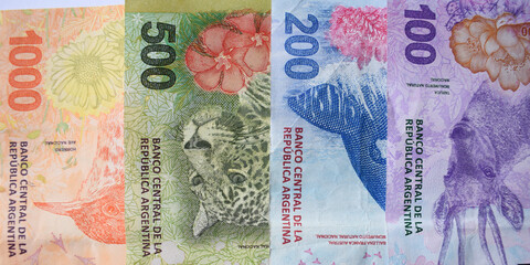 Argentine currency peso bills. Economic and financial concepts. - obrazy, fototapety, plakaty