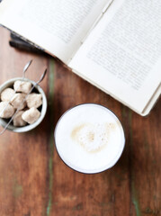 Coffee with milk on wooden background. Top view. Close up.	
