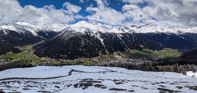 panorama picture from the schatzalp above davos. View of the city of Davos with the snowy mountains in the springtime