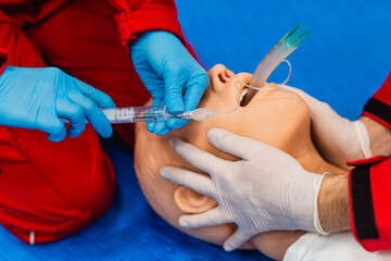 Medical manipulation for airway management. Laryngeal mask airway insertion by stuff in a blue...