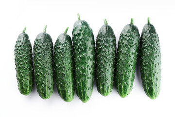 Set of fresh whole cucumbers isolated on a white background, clipping path. Garden cucumber wallpaper backdrop design
