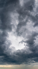 Fototapeta na wymiar Fantastic thunderclouds, vertical panorama