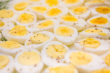 Sliced hard boiled eggs filling entire frame. Macro view