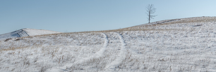 Winter road on the hillside
