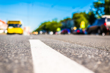 Sunny day in a city, view of the flow of cars to the road level