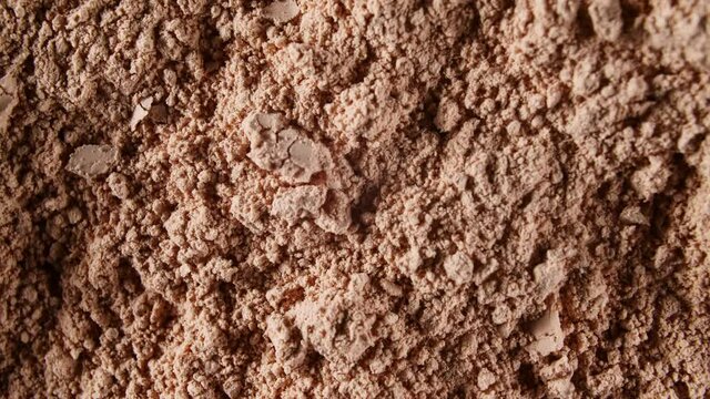 Motion of the Dry Mask made of Clay Powder, Cosmetic Texture with Rotation. Contouring, Make up smears background. Macro Shot. Top view. 4K . High quality 4k footage