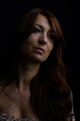 Caucasian woman portrait with black background