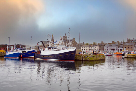 Fishing Boats in Fraserburgh Harbour in the background of the Town, Aberdeenshire,
Scotland, UK. Fraserburgh Harbour is situated in Aberdeenshire in the North-East corner of Scotland. 