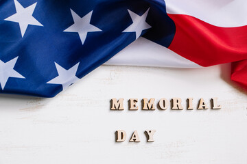 Fototapeta na wymiar USA Memorial Day concept. American flag and text on white background. Celebration of national holiday.