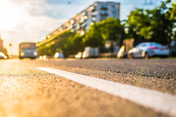 Sunny day in a city, view of the approaching bus to the road level
