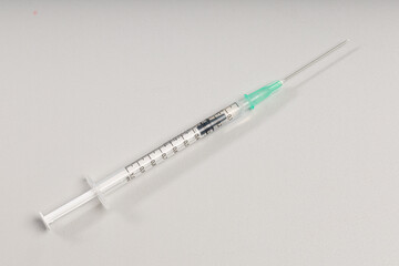 close-up of a syringe pulled up with a vaccination serum