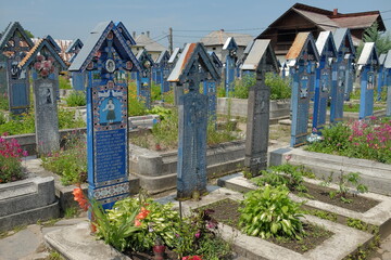 The Merry Cemetery is a cemetery in the village of Sapanta, Maramures county, Romania. In the Merry Cemetery, grave markers celebrate life with beautiful images and gentle wit.