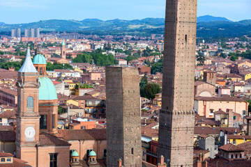 Two famous falling Bologna towers Asinelli and Garisenda. Evening view, Bologna, Emilia-Romagna, Italy. © xamnex