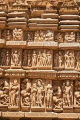 Erotic depictions, deity figures and busty 'Beautiful Girls' - all the figures at the Kandariya Mahadeva Temple are almost fully sculptured. Day. Normal Perspective. Khajuraho. India.