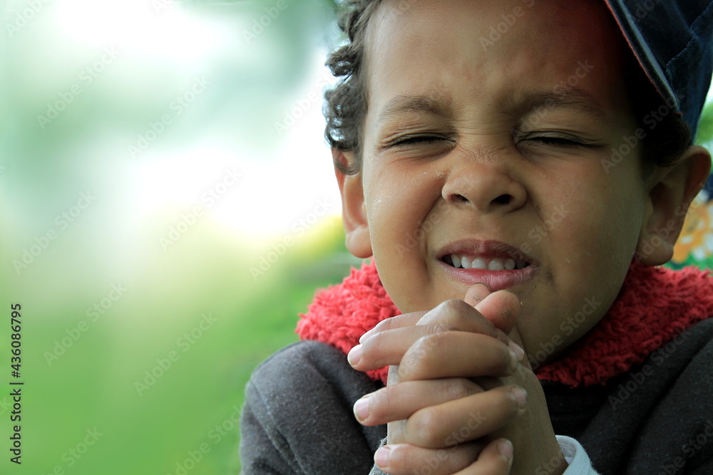 Canvas Prints boy praying to God with hands together stock photo