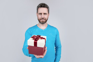 handsome mature man with beard give present box, selective focus, birthday