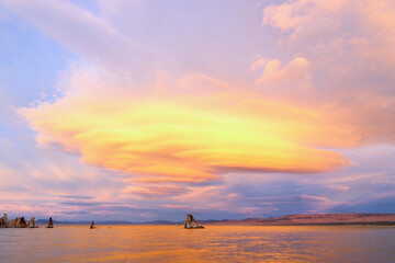 Fantastic colors over Mono Lake with lenticular clouds moving over it at a twilight