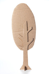 Tree made of cardboard on a white background. Children art project. DIY concept. Cardboard craft.