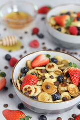 Pancake cereal with fruit, honey and chocolate chips 