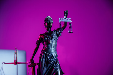 Bronze statue Lady Justice holding scales and sword in notary office on purple background