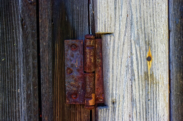 rusty door hinge on the barn