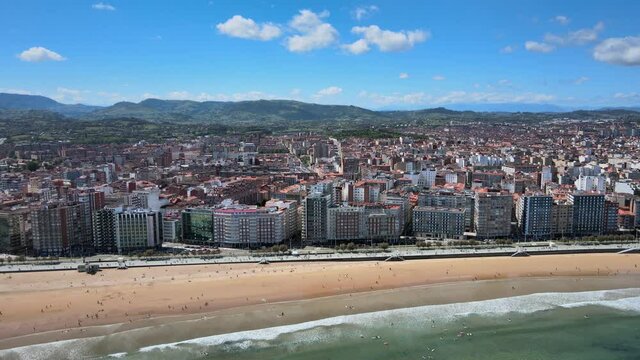 Gijon Xixon downtown and San Lorenzo beach aerial drone. Gijón or Xixón is the biggest city in Asturias, Spain. 