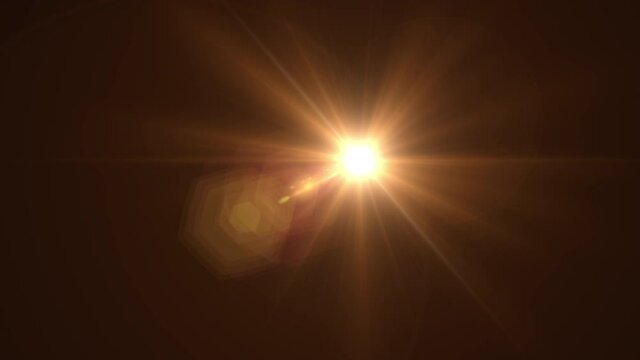A golden flash of light. Sun glare, dawn, glare motion. Sun ray. 4K video.