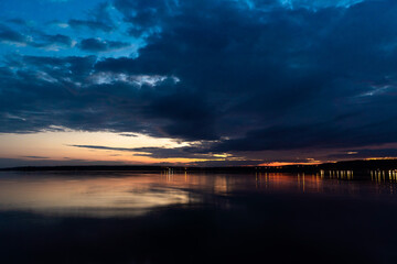 Fototapeta premium Russia. May 16, 2021. Cloudy sky before dawn on Sukhodolsky lake.