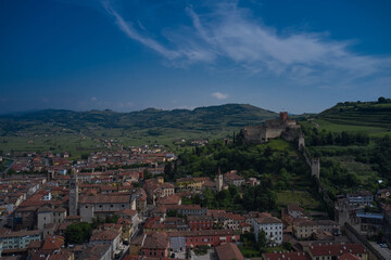 Fototapeta na wymiar Soave castle aerial view, province of Verona, Italy. Aerial panorama of Italy castles. The famous medieval castle on the hill.