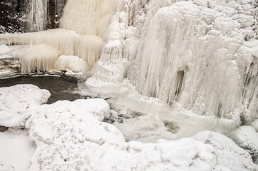 Frozen Aleksupite waterfall in Kuldiga, Latvia.