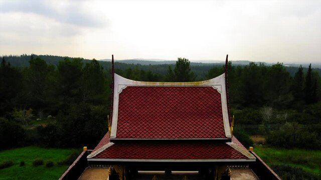 Aerial Forward Shot Of Pagoda, Drone Flying Over Traditional Building In Ben Shemen Forest