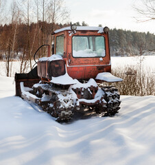 Bulldozer on the snow in winter.
