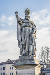 Two rings of statues at small canal in Padua Prato della Valle (Pra deła Vale) - largest square in Italy with a green island at center. Padova (Padua), Veneto, Italy.