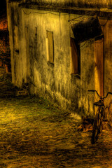 Night urban landscape of abandoned and old city. Rocky floor. High contrast image. Colonia del...
