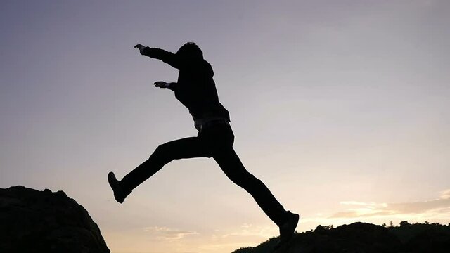 Asian Businessman Jumping, Slow Motion
