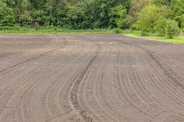 Fototapeta premium A farm field with no residue that has been rolled.