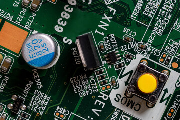Orange button on computer motherboard.