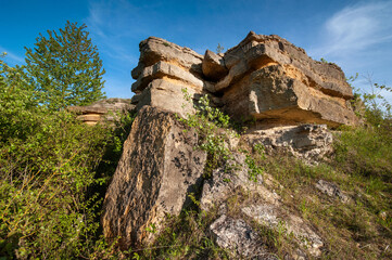 Layered rocky ledge of sandstone rock, natural ledge