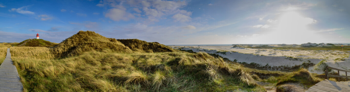 Boardwalk through the dunes to orientation and vantage point: lighthouse as cross-brand fire south of Norddorf on island Amrum, Nordfriesland, Schleswig-Holstein, Germany. Boardwalk to the beach.