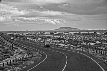  landscape with road and ocean on the spanish canary island of fuertaventra on a sunny day