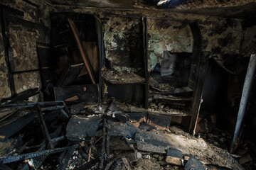 Burnt old house interior. Consequences of fire