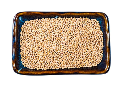 white mustard seeds on rectangular plate cutout