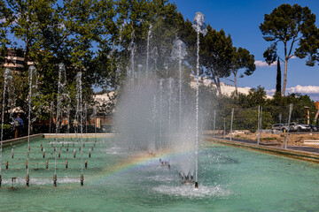 urban landscape of the spanish city of Zaragoza on a warm spring day with fountains in the landmark park