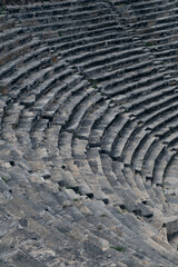 Ancient Roman amphitheater made of stone under the open sky in Pamukkale in Turkey