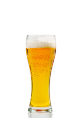Fresh cold Beer glass isolated on white. gold beer bavaria oktoberfest with foam crown. pint of light lager beer on white background. Craft Beer close up